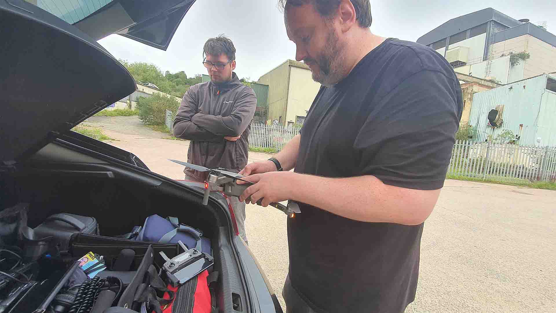 Michael Collins and David Collins preparing to fly a drone for test footage.